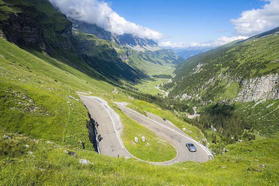 Car traveling on the hairping bends of Klausenpass mountain road, Canton Uri, Switzerland