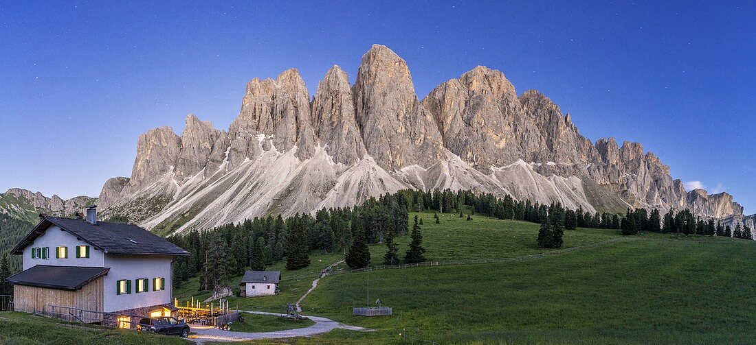 Panoramic of the Odle at dusk seen from Glatsch Alm hut, Val di Funes, South Tyrol, Bolzano province, Dolomites, Italy