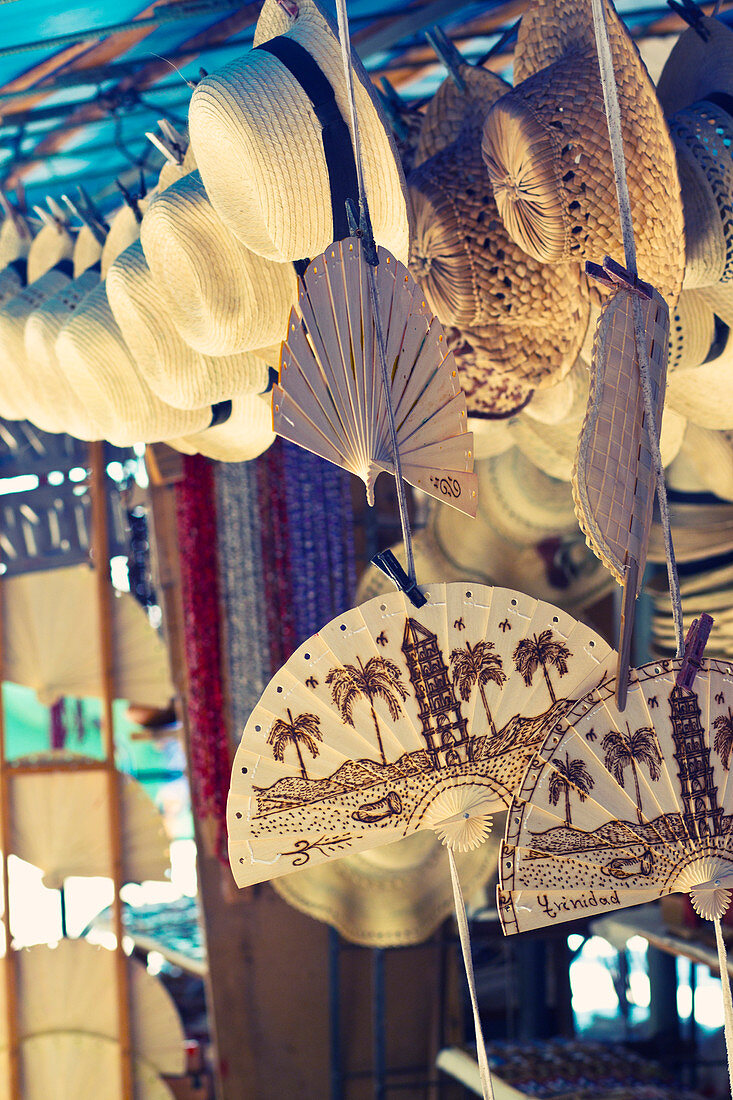 Straw hats and wooden fans on the market in Trinidad, Cuba