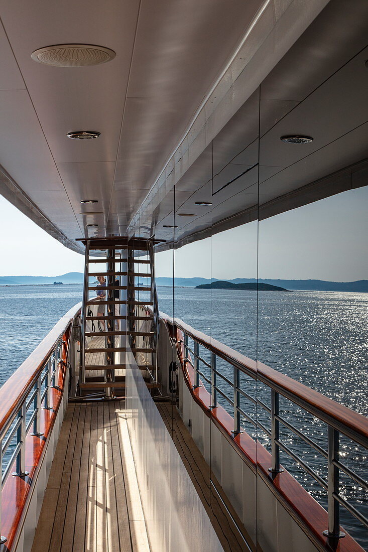 Islands are reflected in window of cruise ship, near Kukljica, Zadar, Croatia, Europe