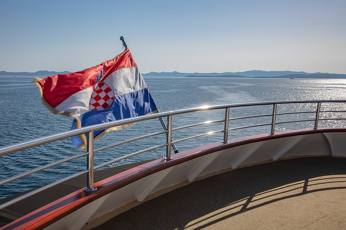 Croatian national flag on board the cruise ship, near Kukljica, Zadar, Croatia, Europe