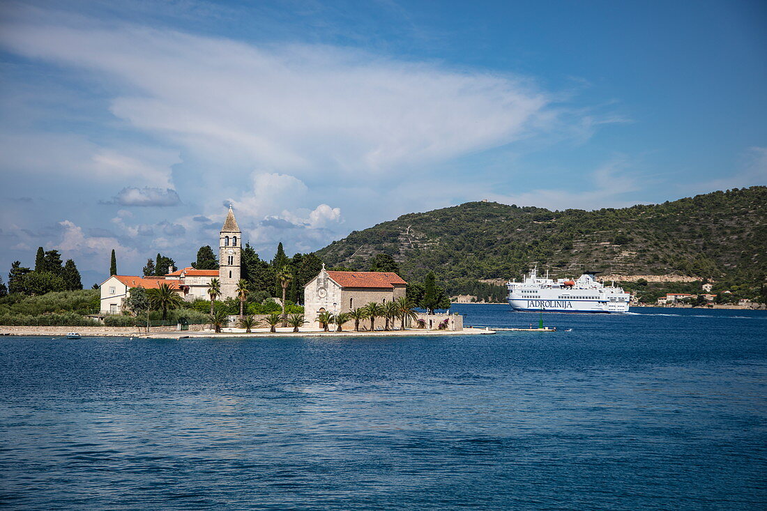Church on peninsula and coast with ferry, Vis, Vis, Split-Dalmatia, Croatia, Europe