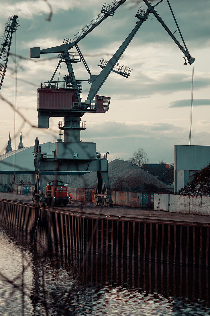 Port facility in Regenburg with a train and cranes in the background, Regensburg, Germany