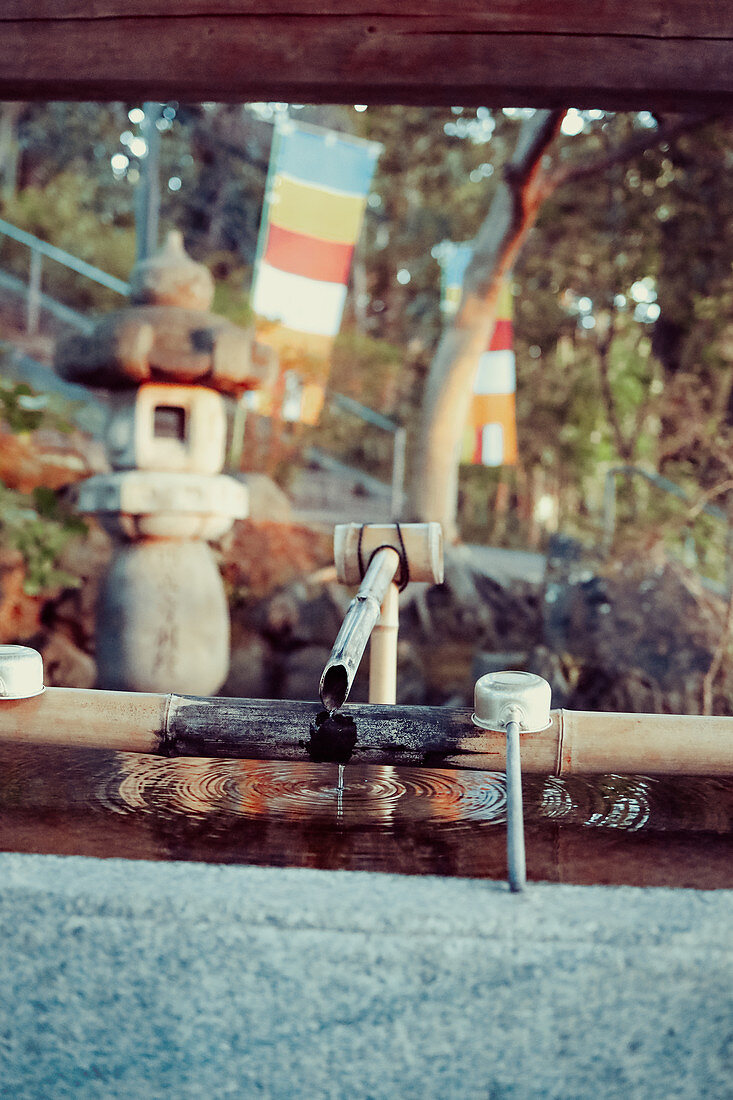 Traditional washing station at a temple complex in Kyoto, Japan