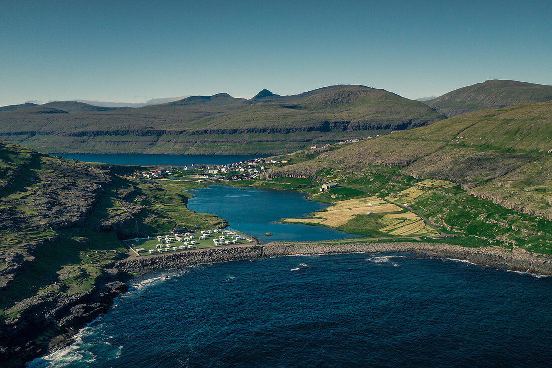 The campsite of Eidi on Eysturoy with the village in the background, Faroe Islands