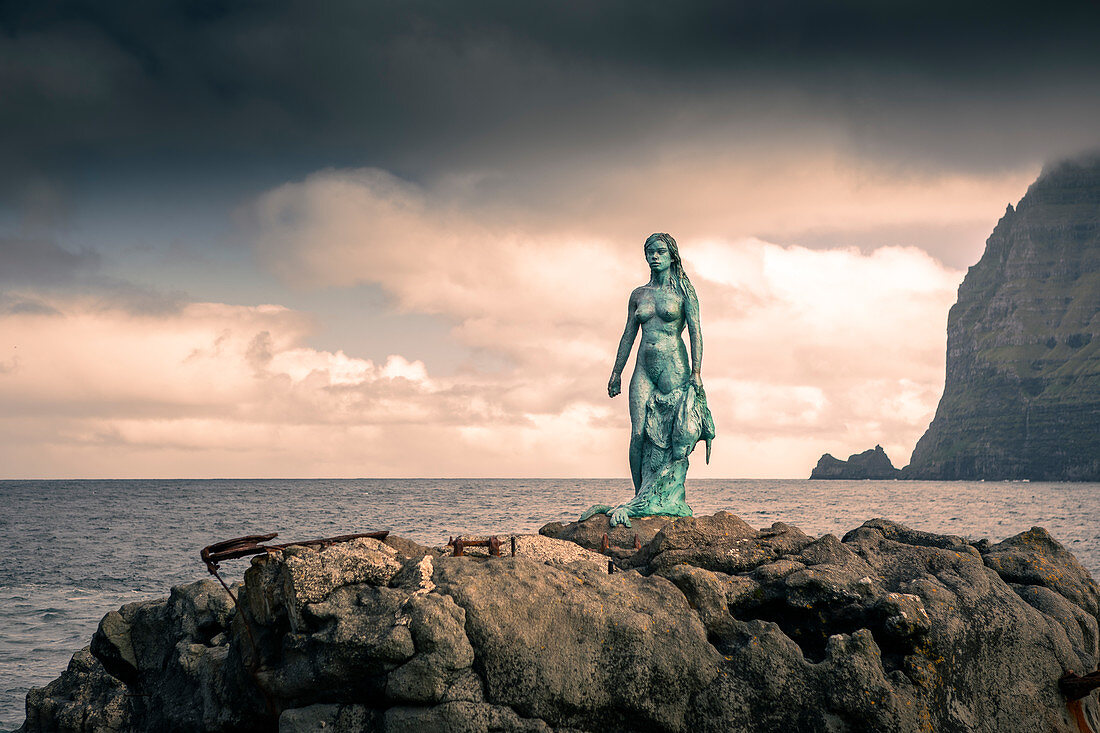 Statue of Kópakonan, mermaid in the village of Mikladalur on the island of Kalsoy, Faroe Islands