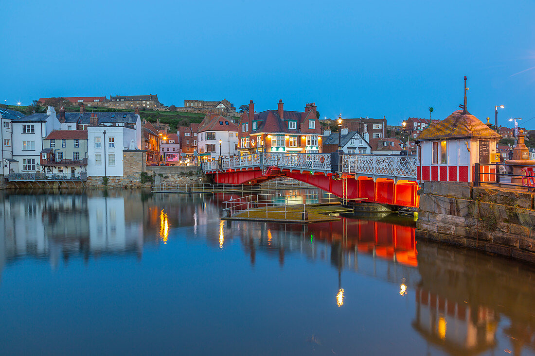 View of Whitby Bridge and reflections on River Esk at dusk, Whitby, Yorkshire, England, United Kingdom, Europe
