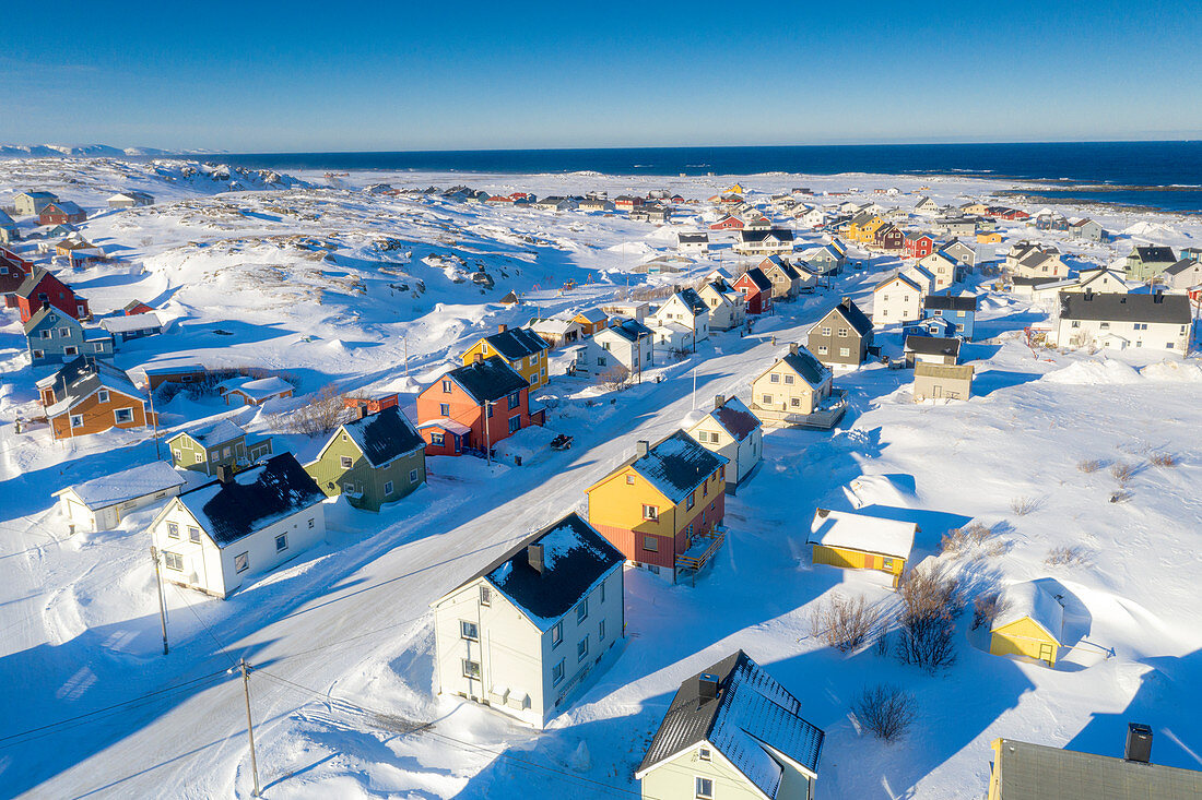 Rows of traditional colorful houses covered with snow, aerial view, Berlevag, Varanger Peninsula, Troms og Finnmark, Norway, Scandinavia, Europe