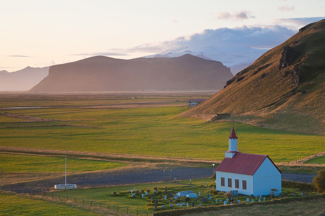 Small traditional white church near Vik, in a valley.