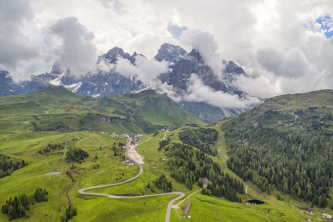 Aerial view taken from the drone of the road that goes up to Passo Rolle during a summer day, Natural Park Paneveggio-Pale di San Martino, Dolomites, municipality of Primiero San Martino di Castrozza, province of Trento, district of Trentino Alto Adige, Italy, Europe