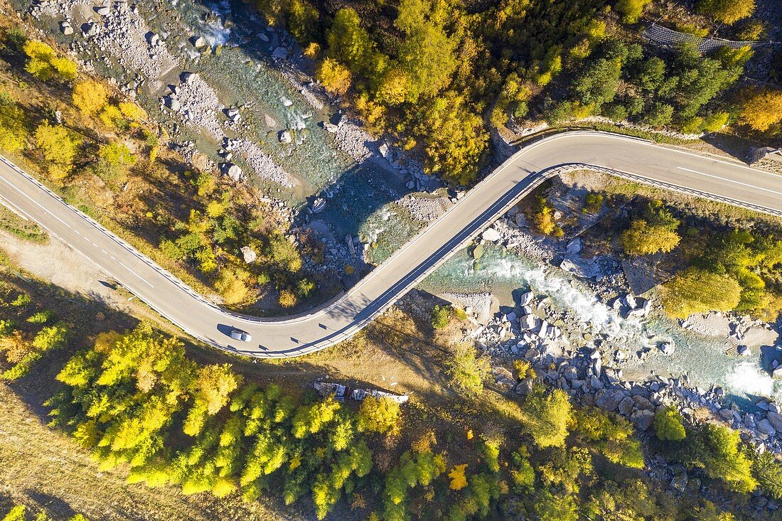 aerial view of the road that crosses the Cogne valley in autumn day, municipality of Cogne, Aosta province, Valle d'Aosta district, Italy, Europe