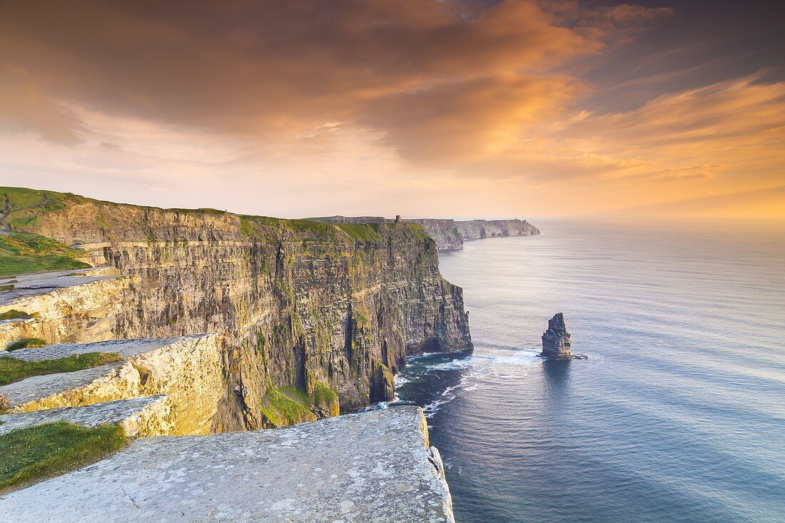 View of a sunset at the Cliffs of Moher. County Clare, Munster province, Ireland, Europe.