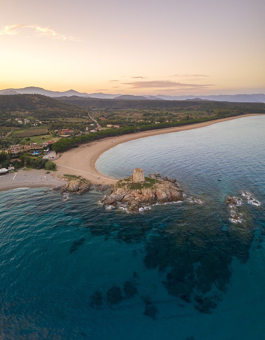 Aerial view of the old tower of Bari Sardo at sunset, Nuoro district, Sardinia, Italy.