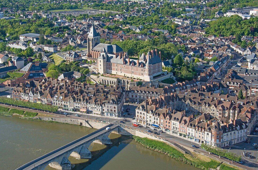 France, Loiret, Gien, Sainte Jeanne d'Arc (Joan of Arc) church, the castle and the banks of the Loire river (aerial view)