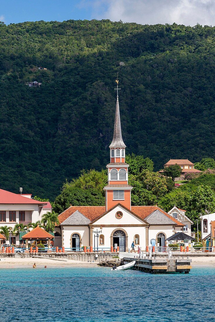 Martinique, view on the village of Anses d'Arlets, pontoon and church Saint-Henri on the beach, Bourg des Anses d'Arlets on the seafront