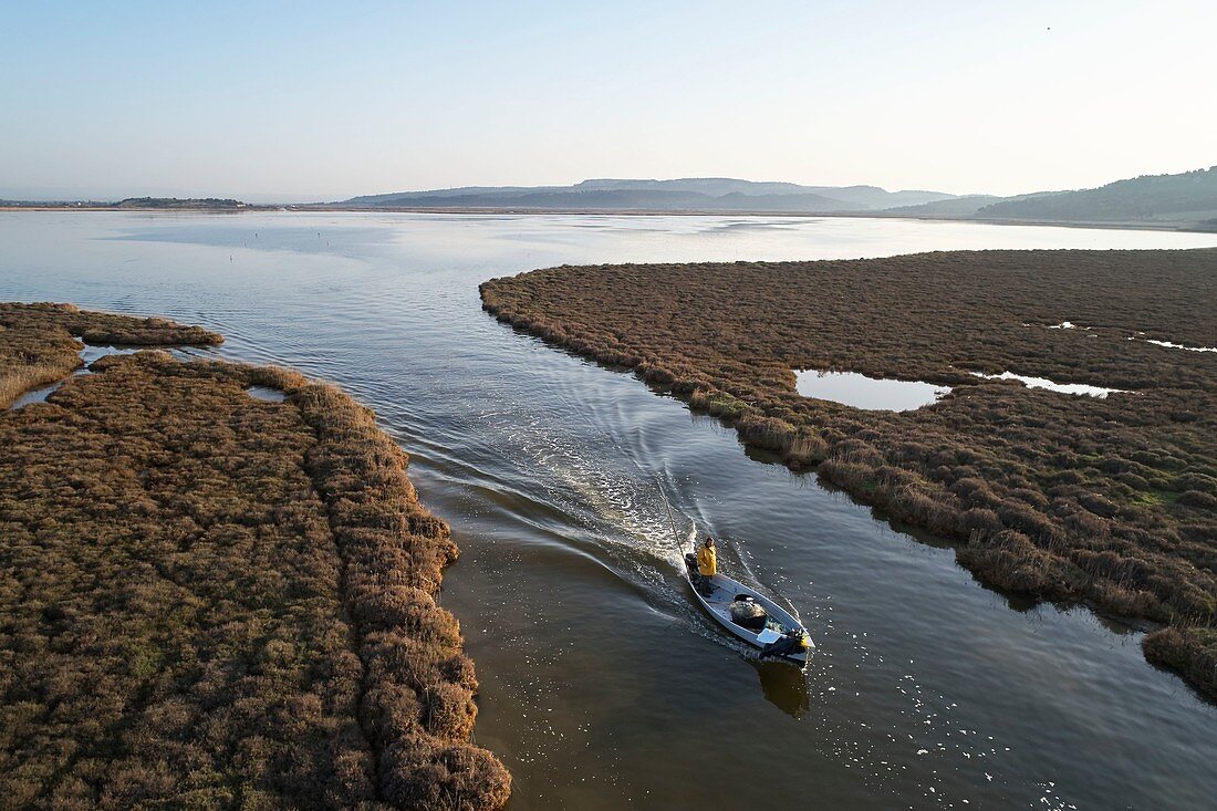 France, Aude, Gruissan, Saint-Martin Island, Ayrolle, Denis Bès, fisherman, passage between the pond of Campignol, in the background and the Ayrolle, aerial view