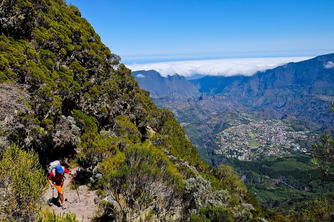 France, Reunion island, Cilaos, hiker and sea of clouds in the Cilaos cirque, listed as World Heritage by UNESCO