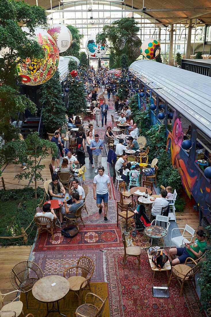 France, Paris, National Library of France (BNF) district, Restaurant La Felicita, of Big Mama, mega restaurant of 4500 m2 in the heart of Station F, the gigantic incubator of start ups, Historic train wagons adorned with street art
