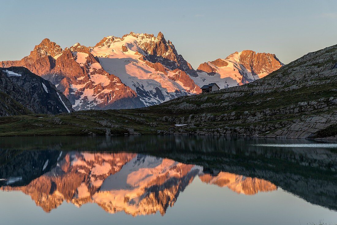 France, Hautes Alpes, Ecrins National Park, the refuge and the lake Goleon (2438m) in the massif of Oisans with La Meije and the Râteau (3809m) in the background