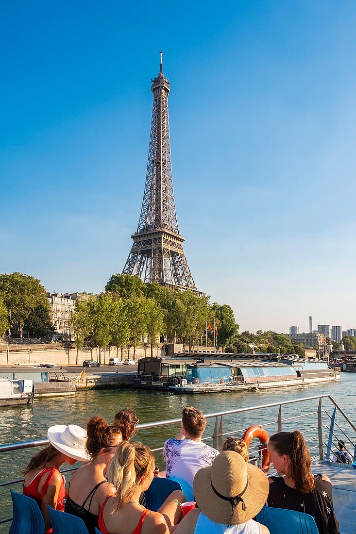 France, Paris, the banks of the Seine classified UNESCO, tourist tour by riverboat in front of the Eiffel Tower
