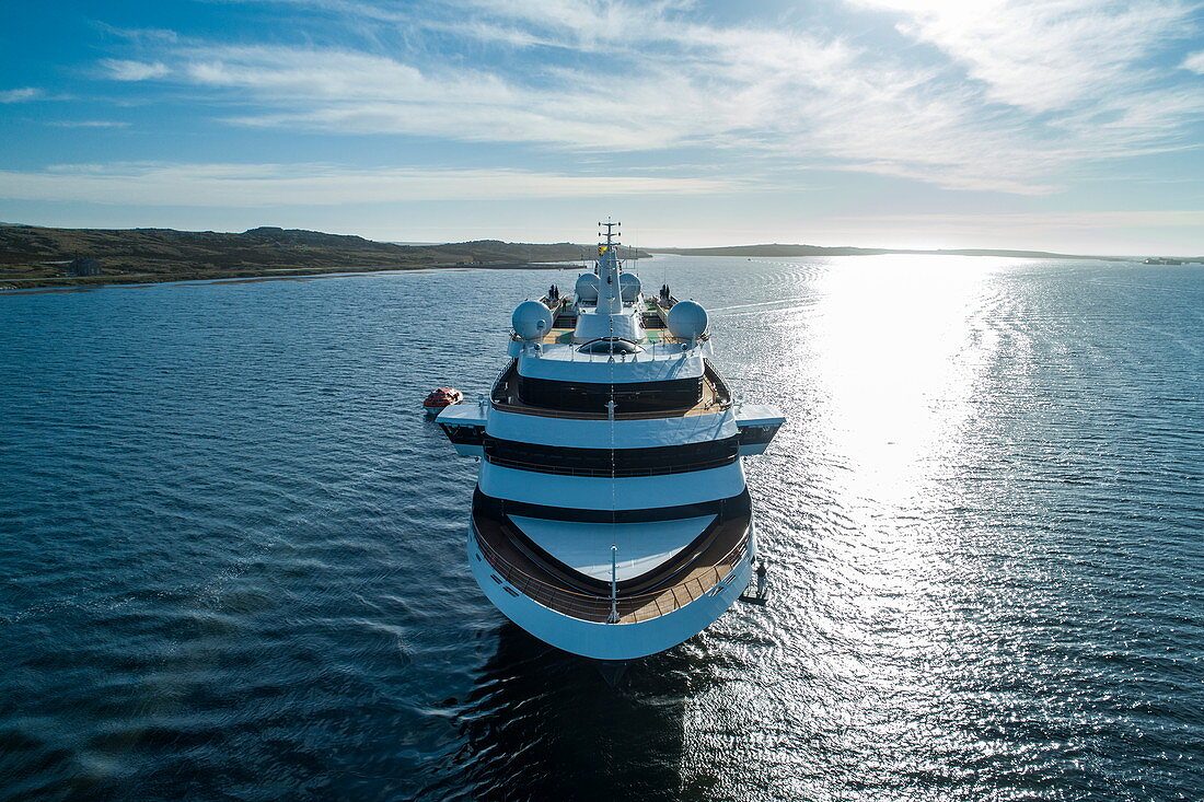 Aerial view from prow of expedition cruise ship World Explorer (Nicko Cruises) with island behind, Stanley, Falkland Islands, British Overseas Territory, South America