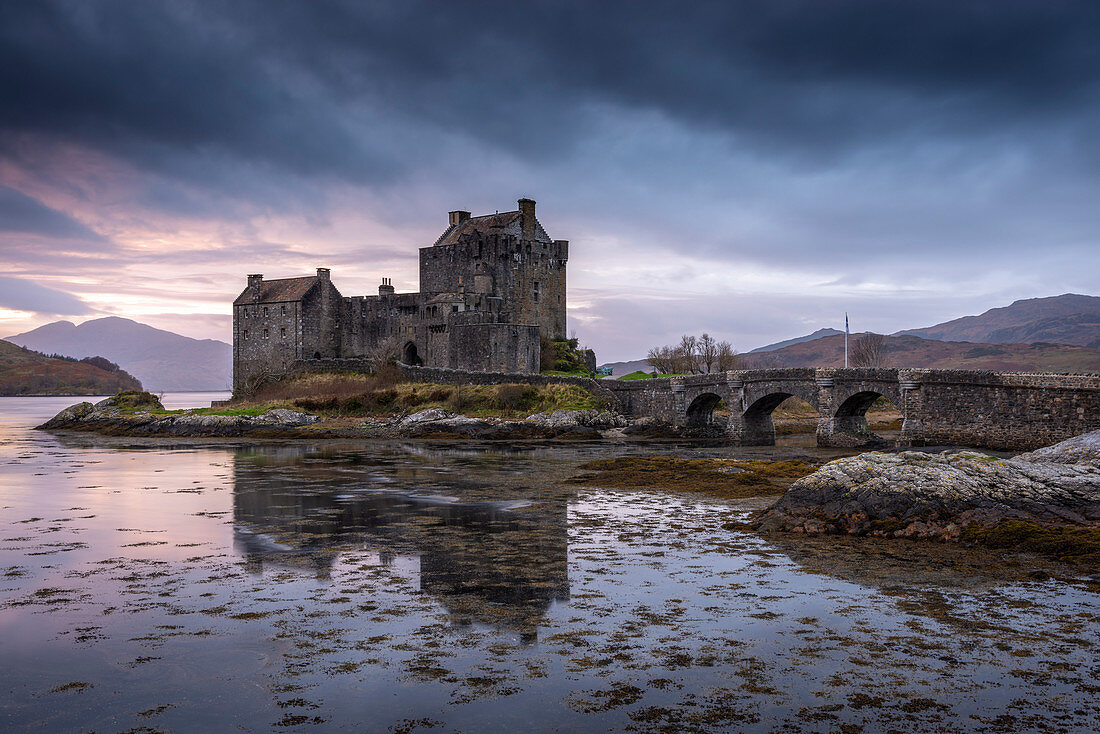 Sunset behind Eilean Donan Castle on Loch Duich in the Scottish Highlands, Scotland, United Kingdom, Europe