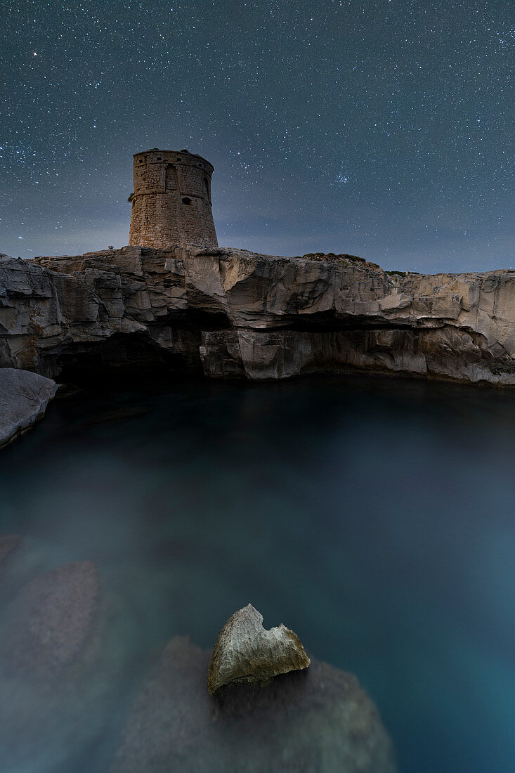 Starry sky over Torre Miggiano tower on cliffs above the sea, Santa Cesarea Terme, Porto Miggiano, Lecce, Salento, Apulia, Italy, Europe