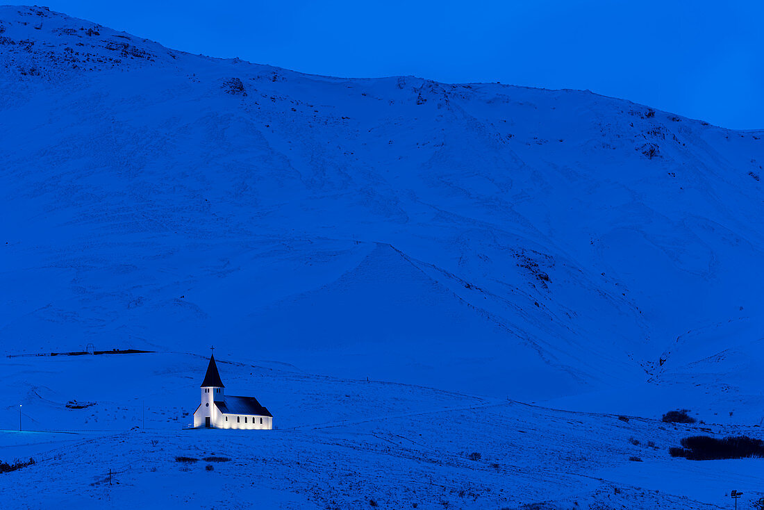 Vik Church illuminated at dawn, Vik, Iceland, Polar Regions