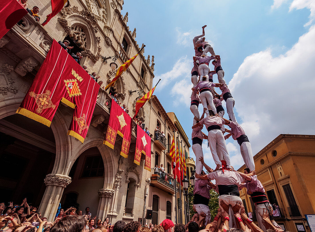 Castell human tower in front of the City Hall during the Festa Major Festival, Terrassa, Catalonia, Spain, Europe