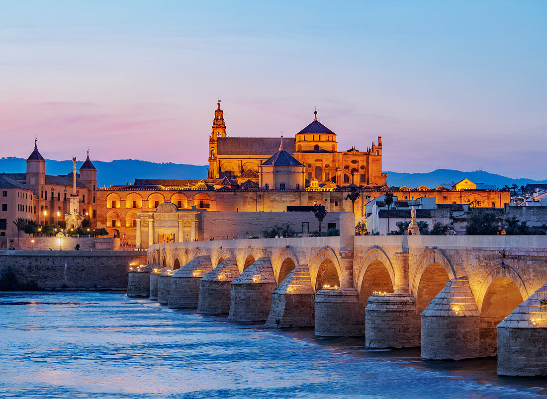 View over Roman Bridge of Cordoba and Guadalquivir River towards the Mosque Cathedral, dusk, UNESCO World Heritage Site, Cordoba, Andalusia, Spain, Europe