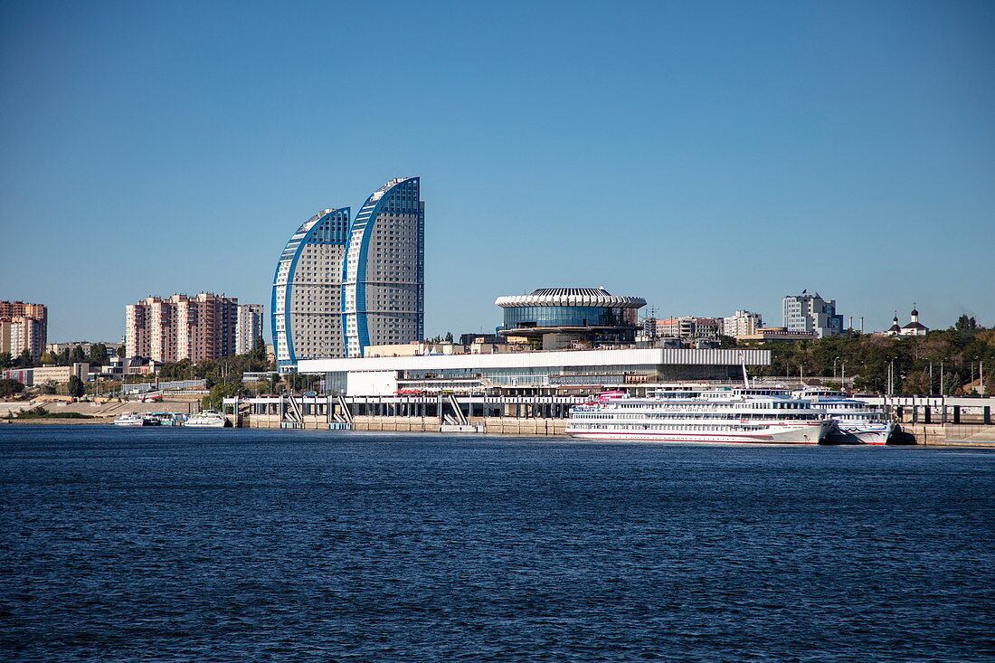River cruise ships at the terminal and high-rise buildings with modern architecture seen from Volga River, Volgograd, Volgograd District, Russia, Europe