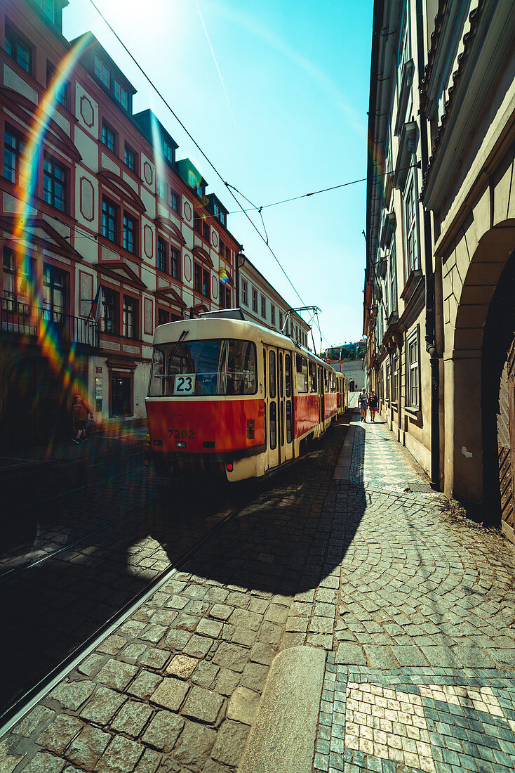 View of tram driving on street in Prague city
