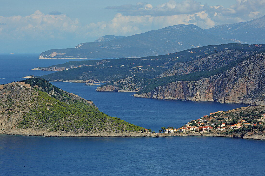 View over the rugged west coast to the north, in the foreground the town of Assos with its castle, Kefalonia Island, Ionian Islands, Greece