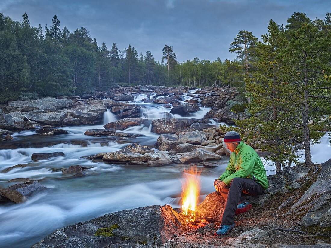 Man at the campfire, Saltelva River, Saltfjellet-Svartisen, Nordland, Norway