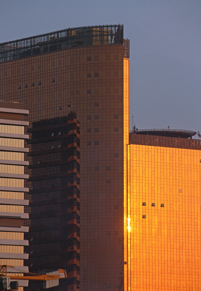 Angola; Luanda Province; Luanda; Capital of Angola; modern office building in the center; The glass facade reflects the sunset
