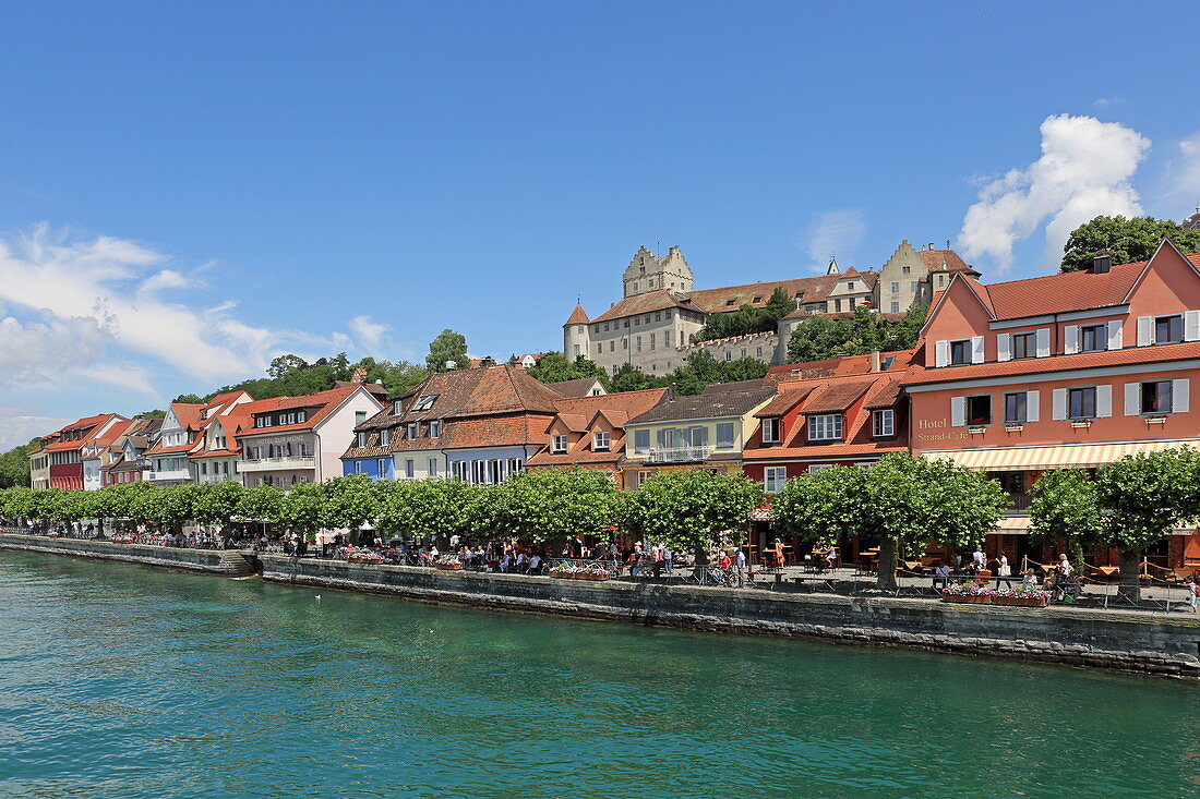View over Lake Constance to the promenade of the town of Meersburg with its medieval castle, Baden-Wuerttemberg, Germany