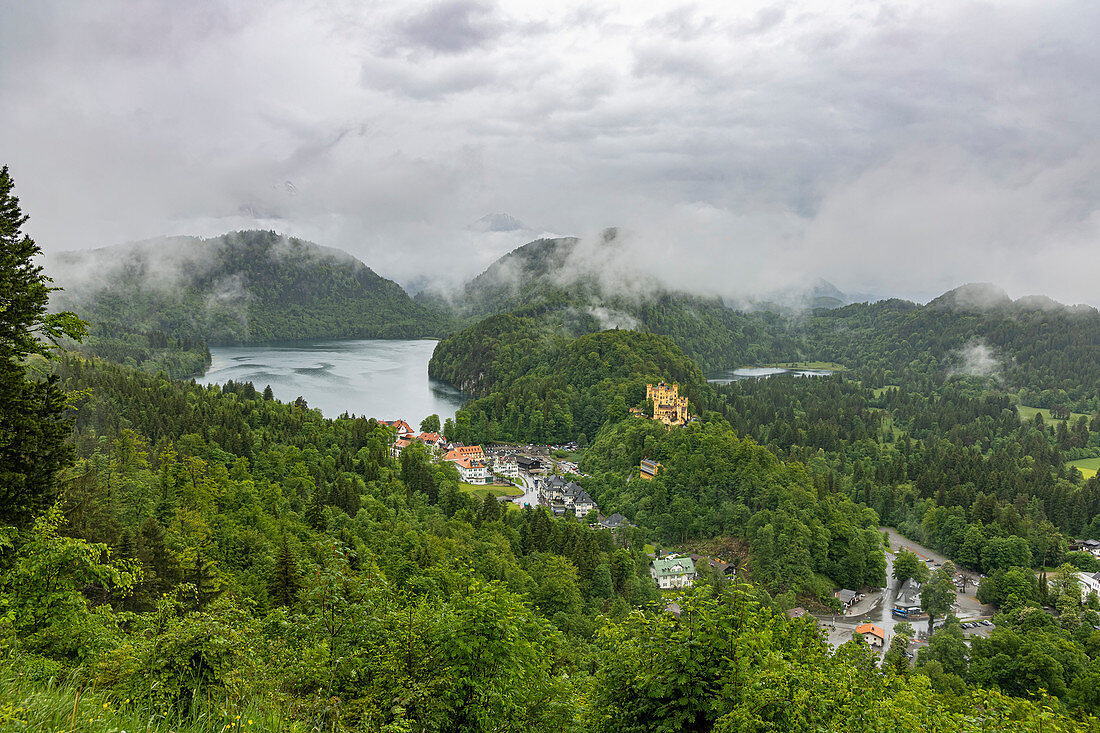 View of Hohenschwangau Castle and surroundings with low clouds, Schwangau, Upper Bavaria, Germany