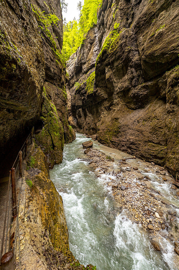 View through the rock walls and the river of the Partnachklamm, Garmisch-Partenkirchen, Upper Bavaria, Germany