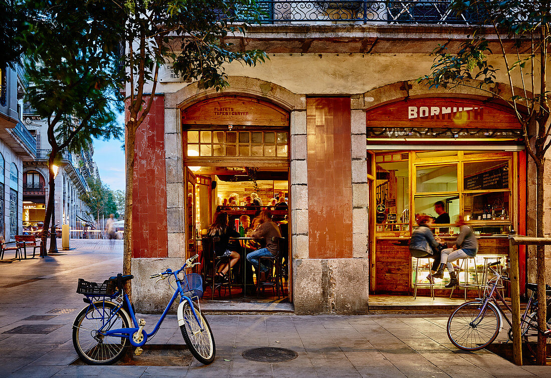 A street scene of a bar and patrons in Bormuth in the Born district at dusk, Barcelona Catalonia Spain