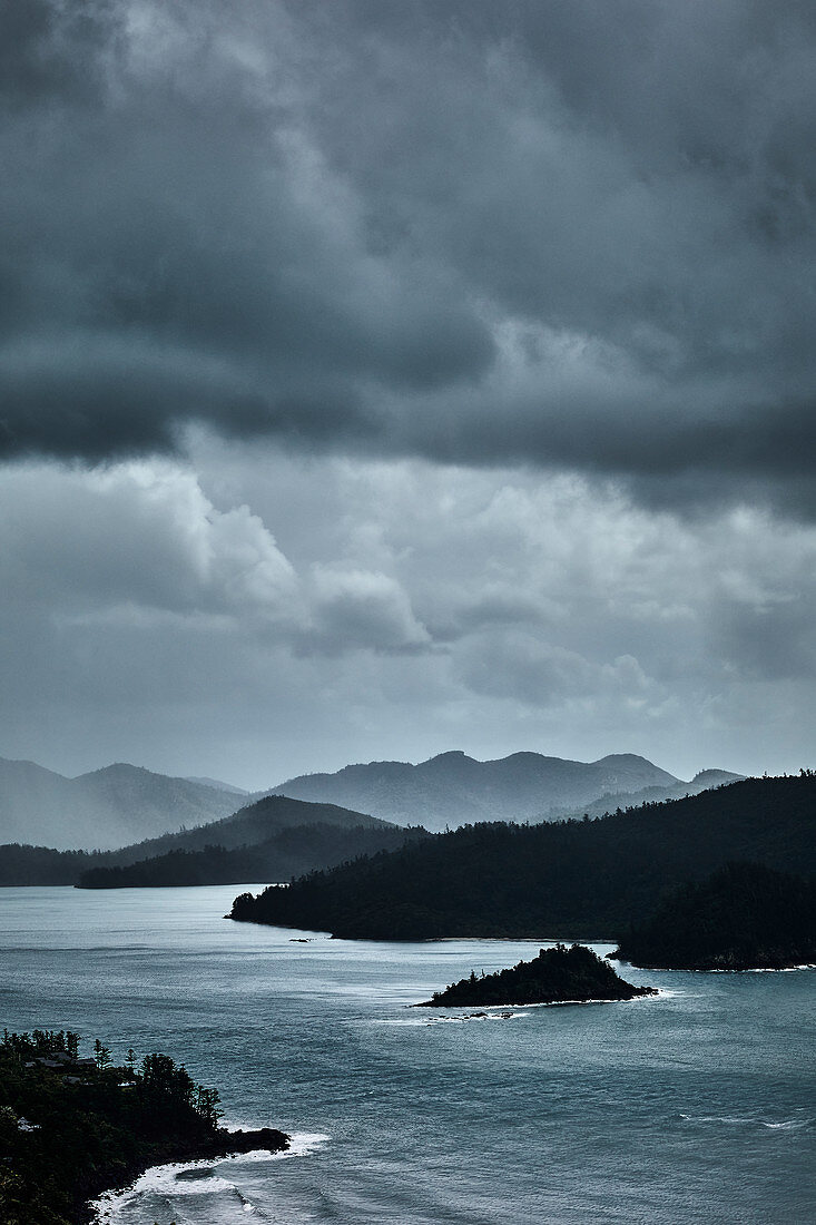 Looking through to the north side of Catseye Beach during a rain storm, Hamilton Island, Whitsunday Islands, Queensland, Australia.