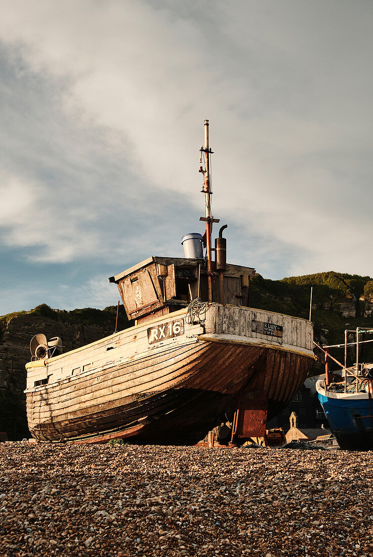 A traditional wooden fishing boat sits … – License image – 71370225 ❘ Image  Professionals