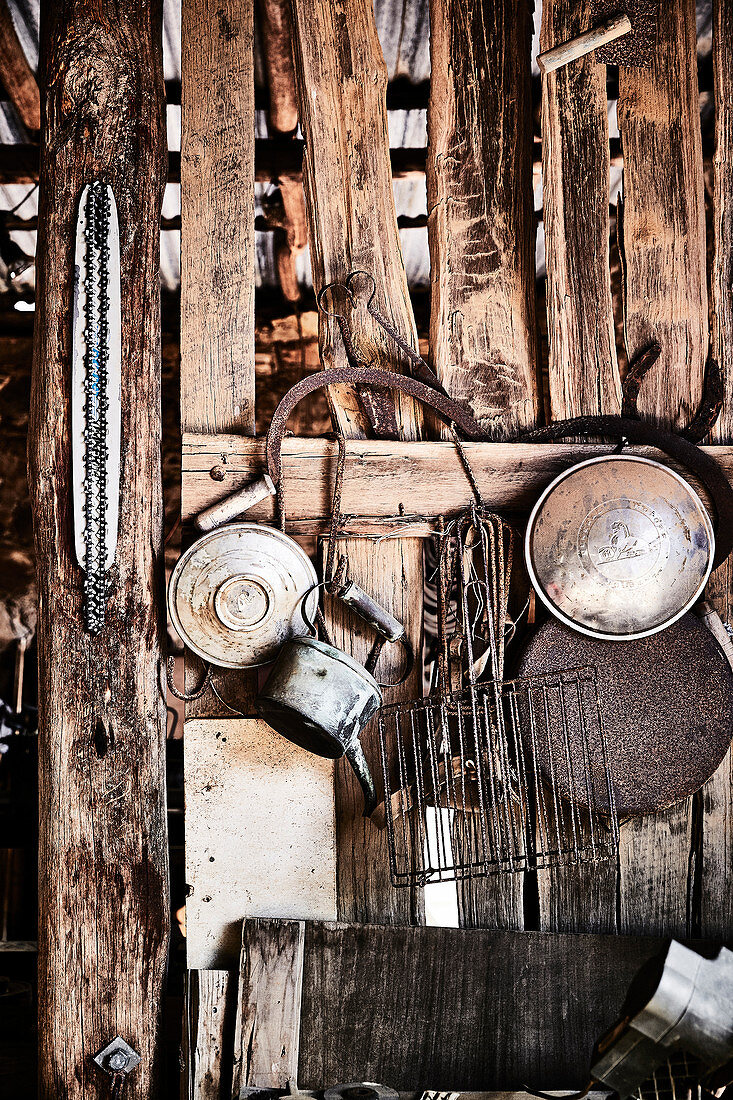 Vintage farm paraphernalia hangs on the wall of an old barn on a property in Mummel, New South Wales, Australia.