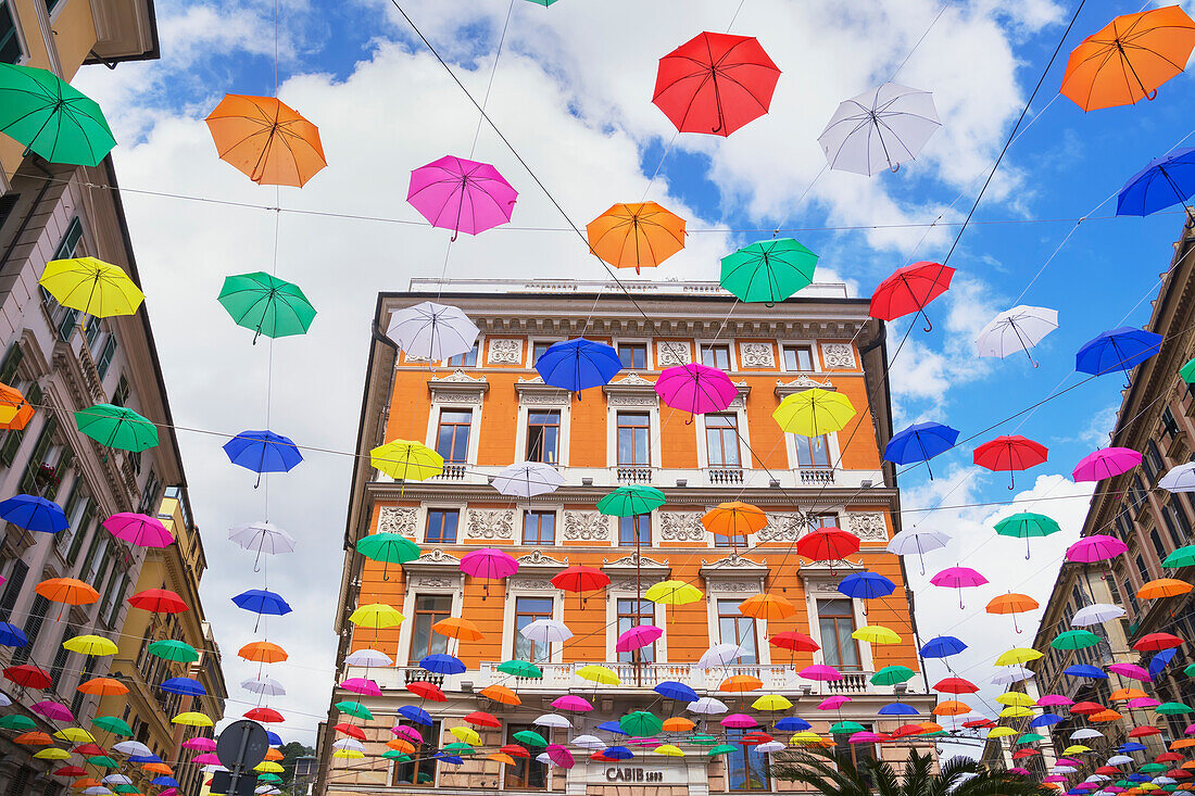 Brightly coloured floating umbrellas, Genoa, Liguria, Italy