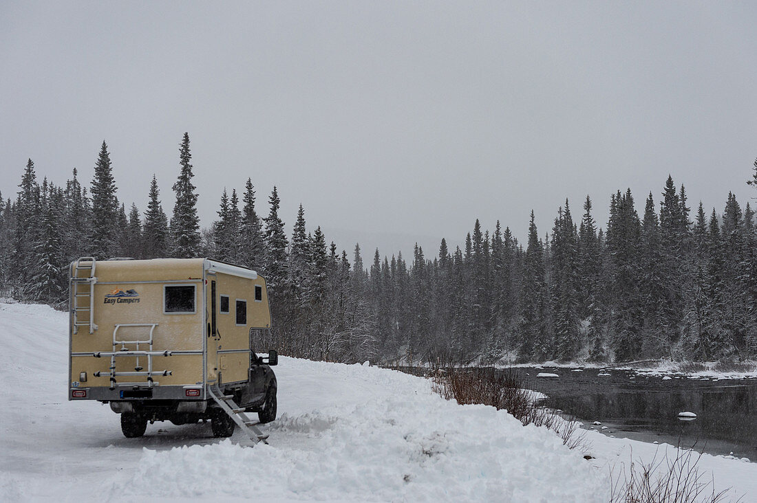 Ford Ranger with add-on cabin in deep snow on a river, Storjola, Lapland, Sweden