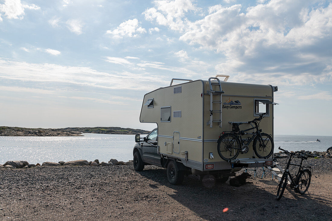 Van with bicycles and dog in front of the sea, Kungsbacka, Halland, Sweden
