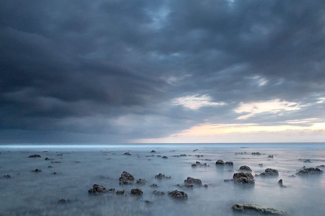 Long exposure of a storm approaching the Gili islands, Lombok, Indonesia, Southeast Asia, Asia