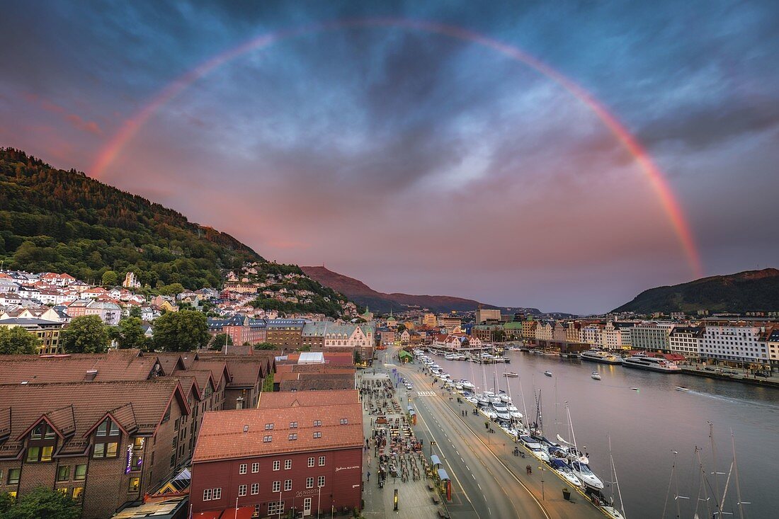 Norway,Western Norway,Bergen,Rainbow over city and fjords at sunset