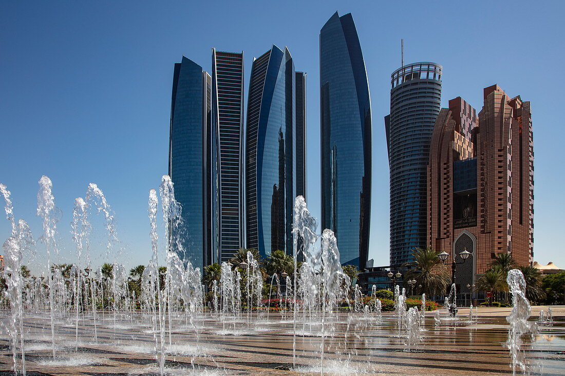 Skyscrapers seen from the fountain below the Emirates Palace Hotel, Abu Dhabi, Abu Dhabi, United Arab Emirates, Middle East