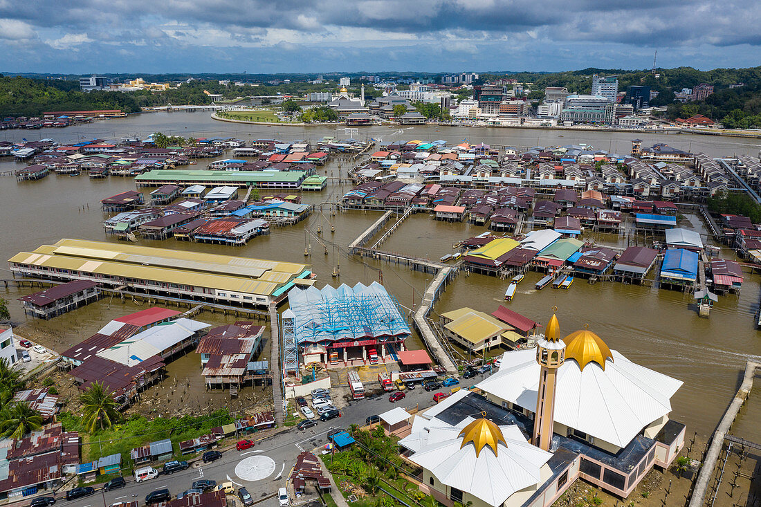 Aerial view of the floating village of Kampong Ayer with downtown behind, Sungai Kebun, Brunei-Muara District, Brunei, Asia