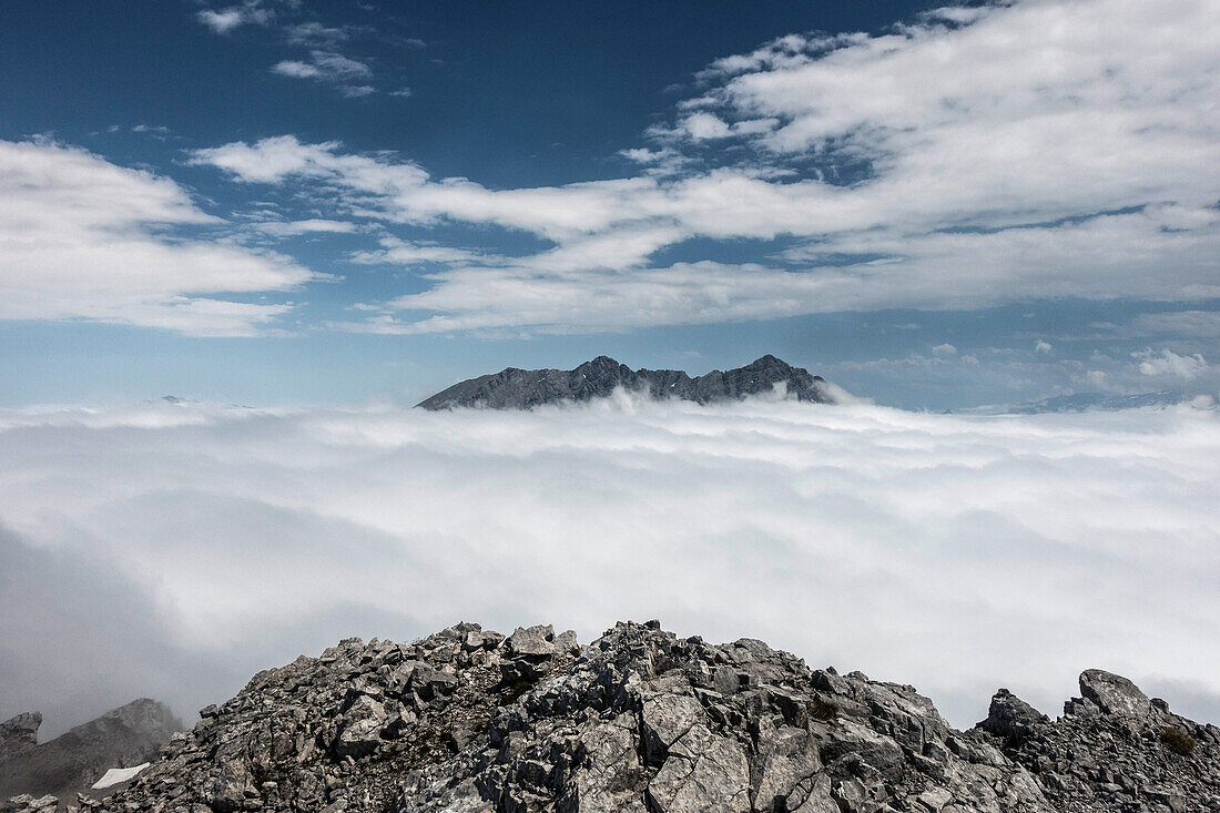 The Watzmann rises from the sea of fog, Berchtesgaden Alps, Bavaria, Germany